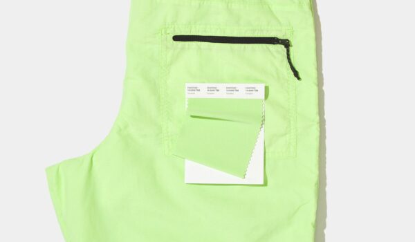 Lime green shorts with Pantone swatch