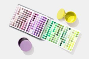 Pantone Paper Traveler book open with purple and yellow container