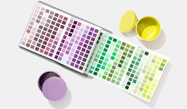 Pantone Paper Traveler book open with purple and yellow container