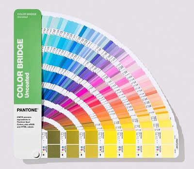 Pantone book open showing CMYK and PMS colours