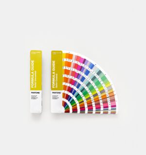 Pantone GP1601C. Formula Guide Set books with yellow covers, one is fanned open to show the colour charts