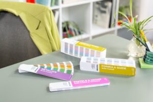 Pantone guides on a graphic designers desk