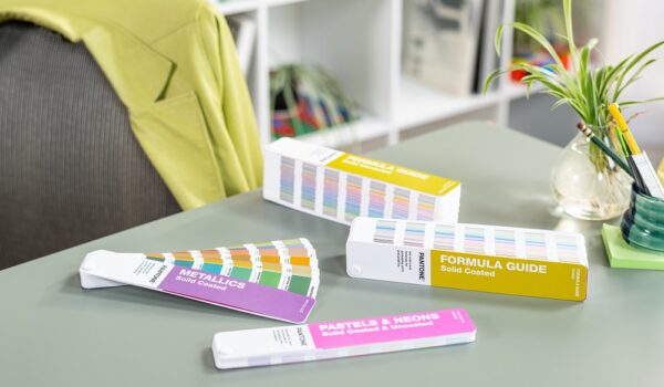 Pantone guides on a graphic designers desk