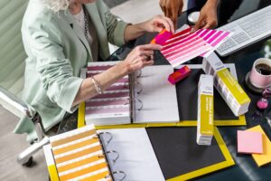 designer using Pantone solid chips to pick colours